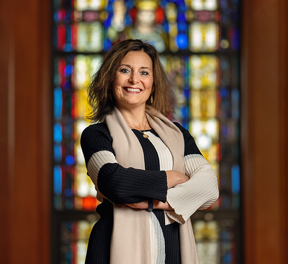 President McCulloh giving a speech with sparkling lights in the background.